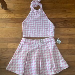 Pink and white patterned 2 piece. Cropped top and skirt. Barbie colored outfit.